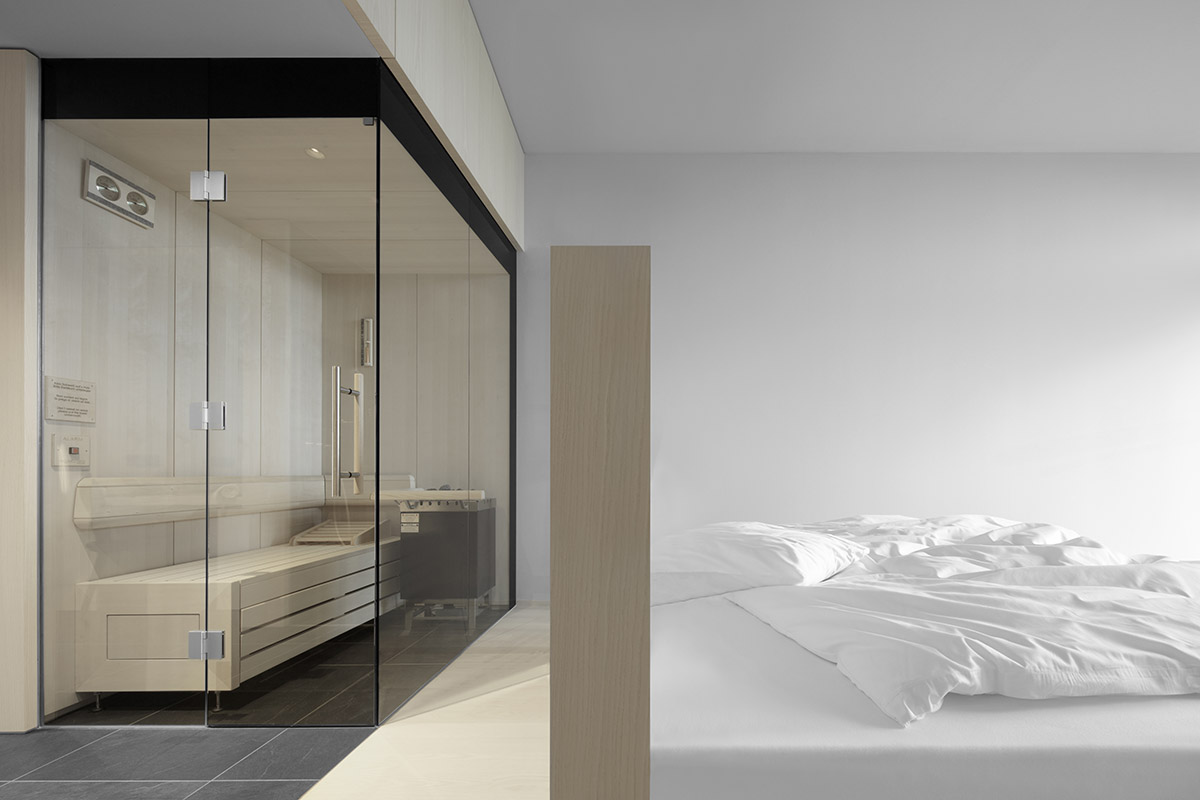 Peter Pichler's Hotel Milla Pontis features black exoskeleton inspired by vernacular architecture