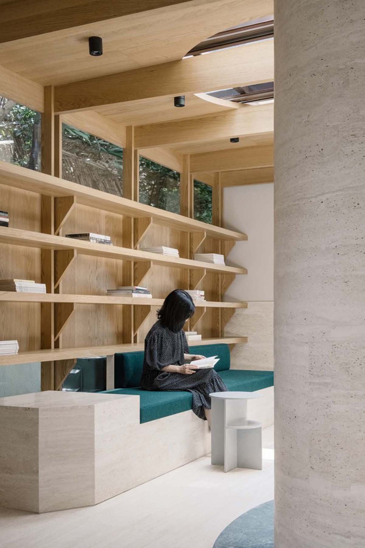 Atelier tao+c creates reading room with semi-circular bookshelves and timber structures in Shanghai 