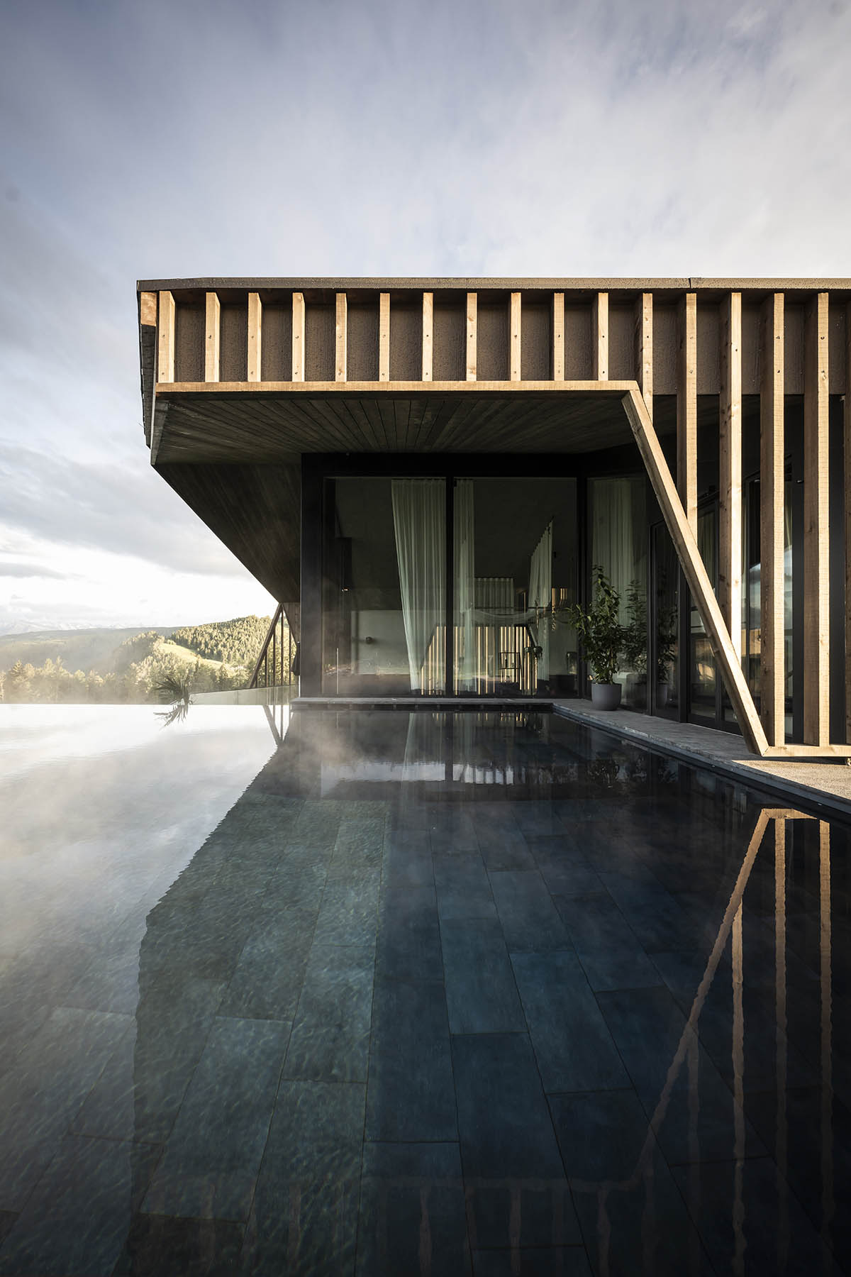 noa* designs boutique hotel and wellness featuring trapezoidal façade in an old farm of Soprabolzano