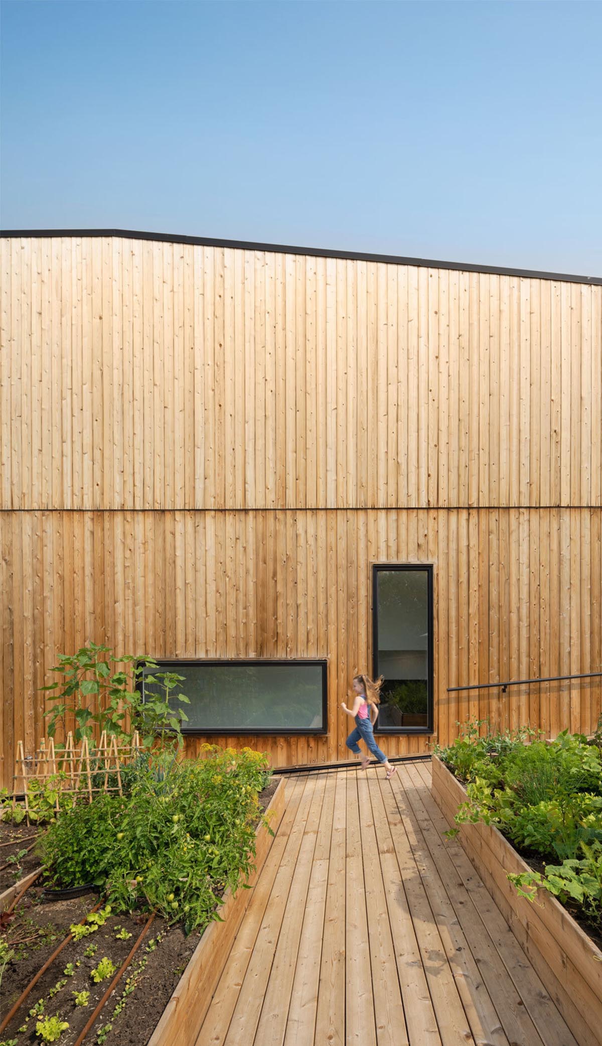 Multi-residential housing by MODA features a barrier-free rooftop urban farm in Calgary