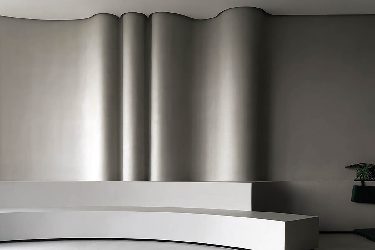 Exhibition hall interiors in China feature unconstrained flowing wall evoking
