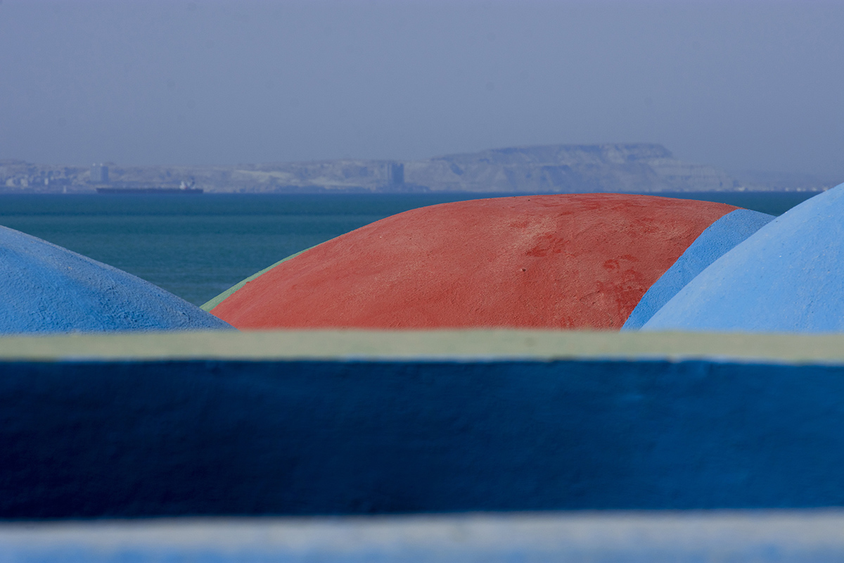 ZAV Architects built colorful-domed housing made of rammed earth and sand on Hormuz island, Iran