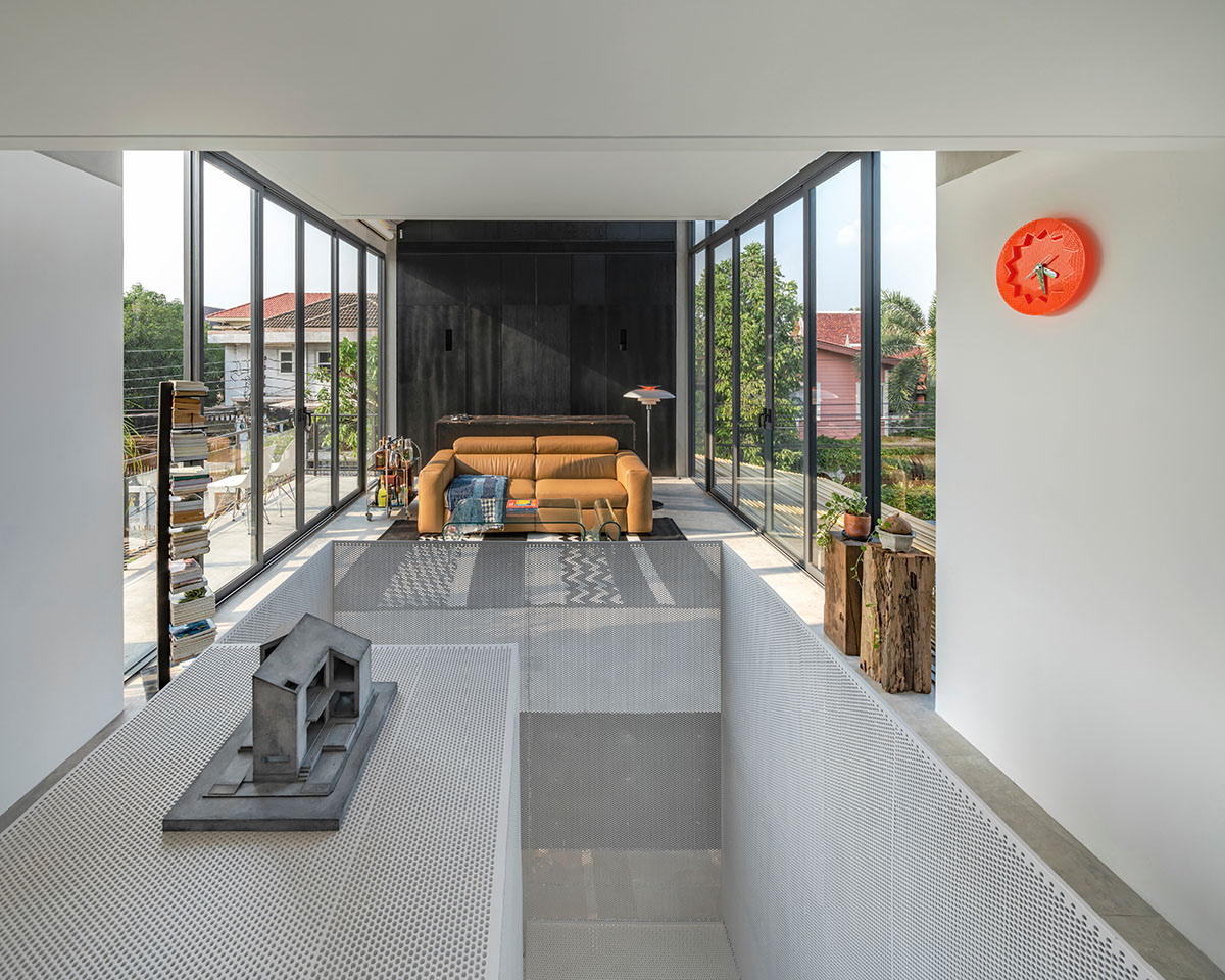 AUN Design Studio adds steel fence to private home for airy entrance in Bangkok
