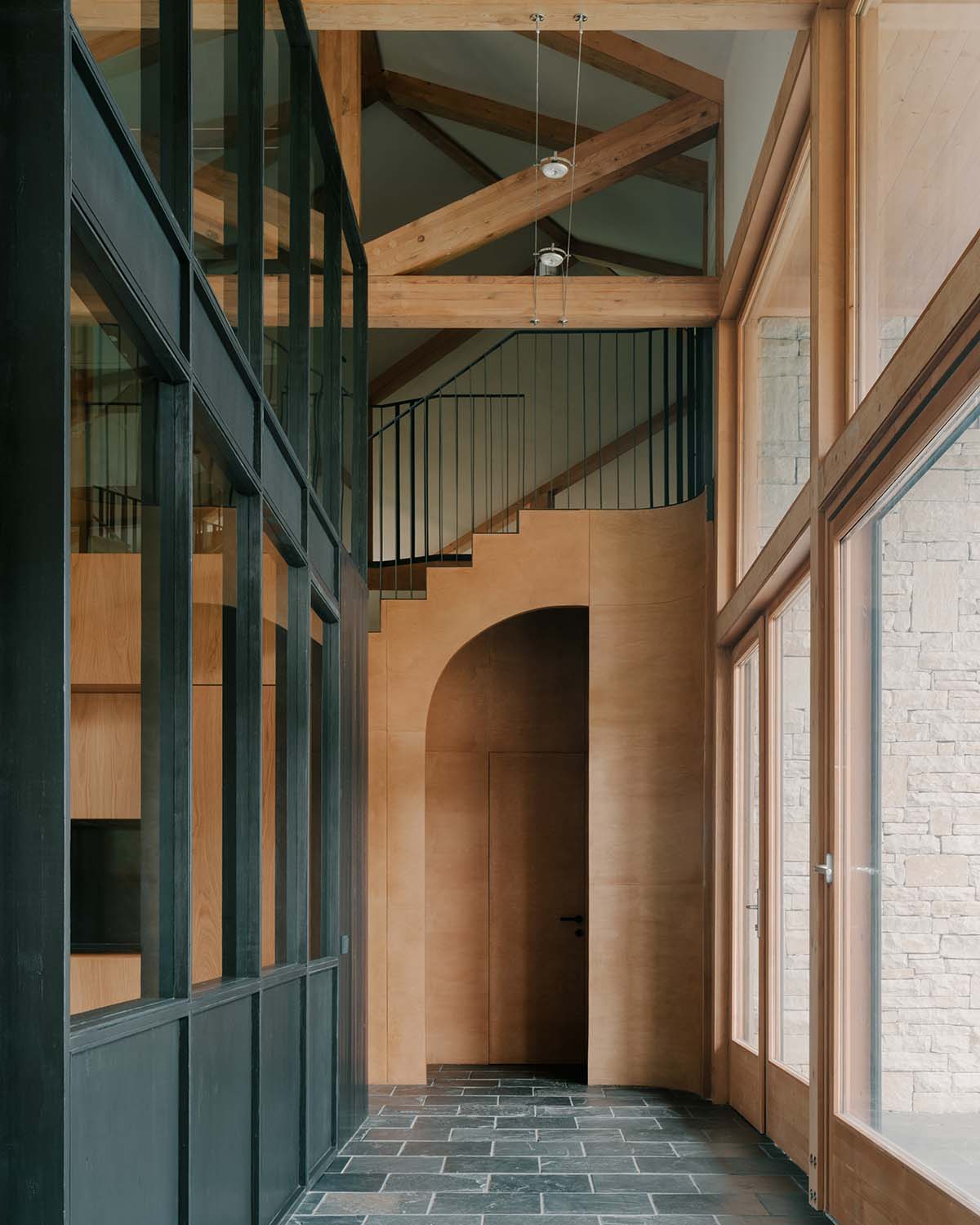 The stone and wood Tbilisi residence integrates architecture with the natural landscape