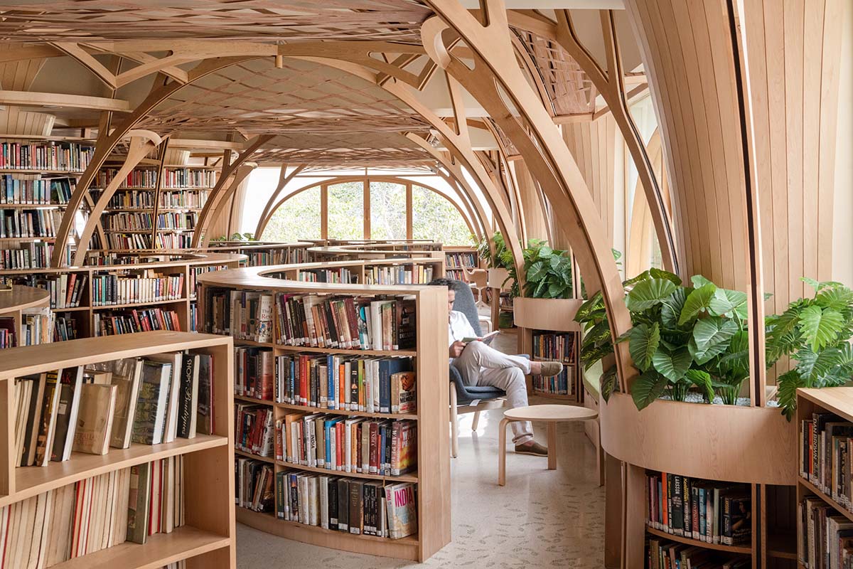 studio Hinge embeds a library under the wooden tree-like canopies in Mumbai