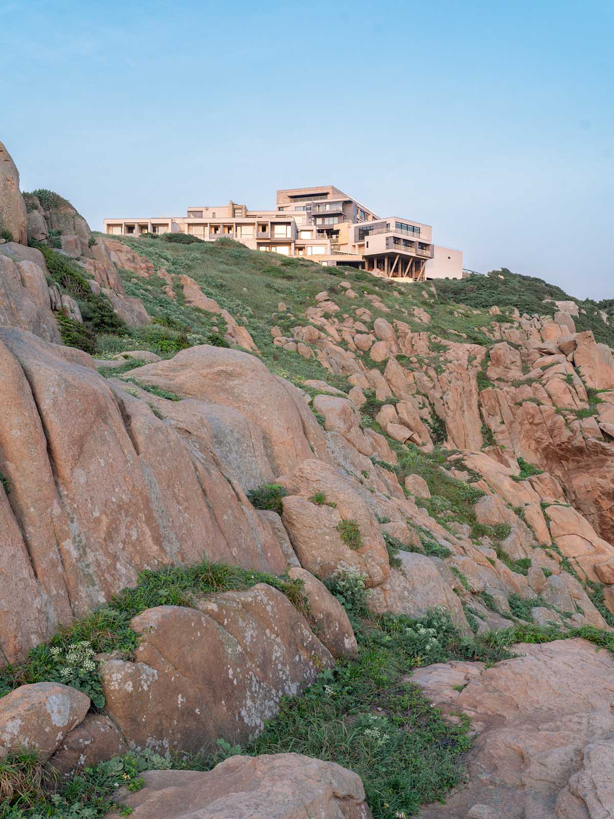 The Lighthouse Hotel reinterprets traditional fishing village settlements on a steep reef in Zhoushan