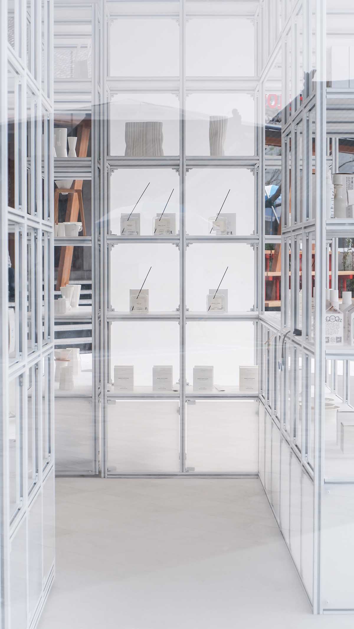 A shop is attached to Beijing historic Hutong houses with white-colored skin