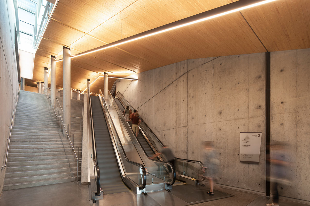 A striking bell tower pierces the sky, illuminating the grandeur of the pavilion in Montreal