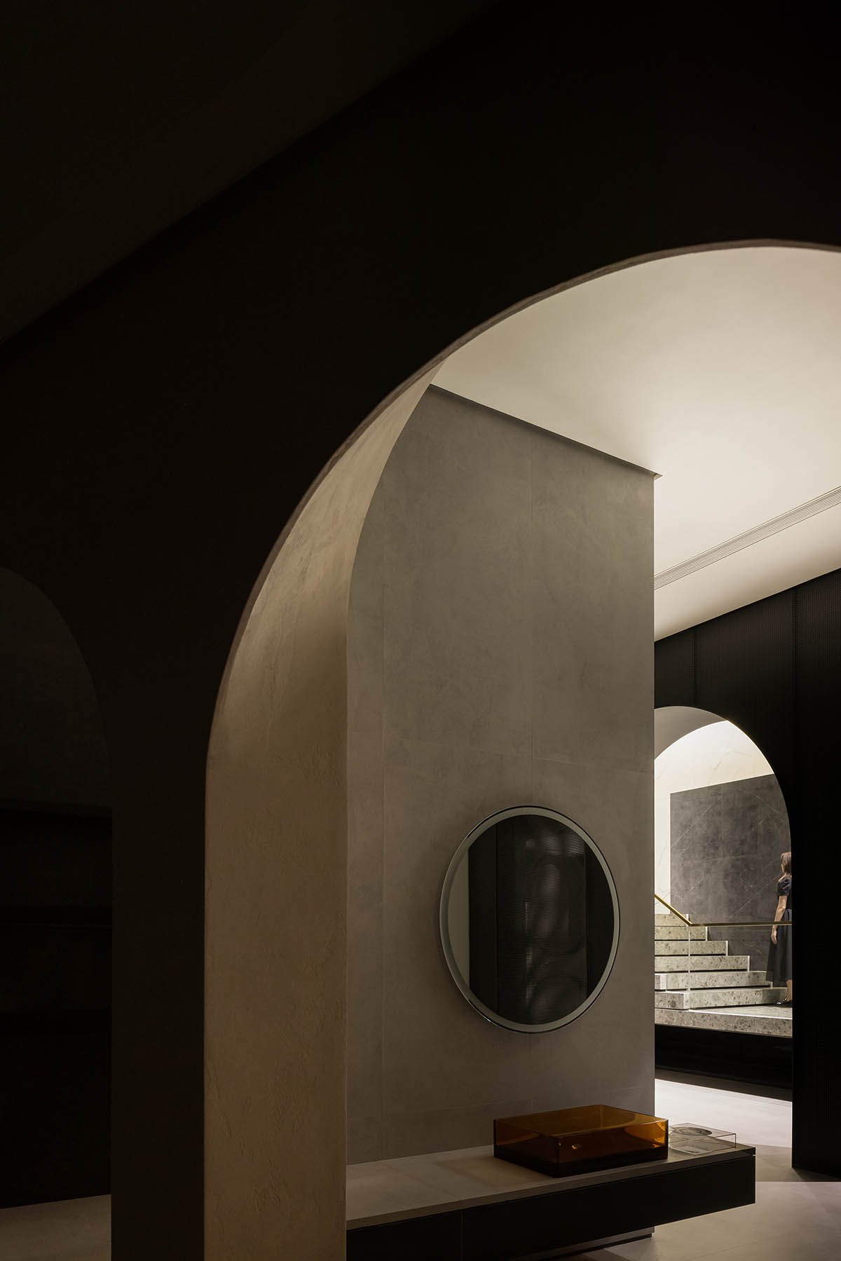 Curved walls and cave-like holes form I.T CERAMICHE Headquarters by Foshan Topway Design