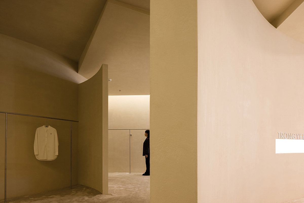 AD ARCHITECTURE designs store with light yellow curved walls that create comfort and softness 