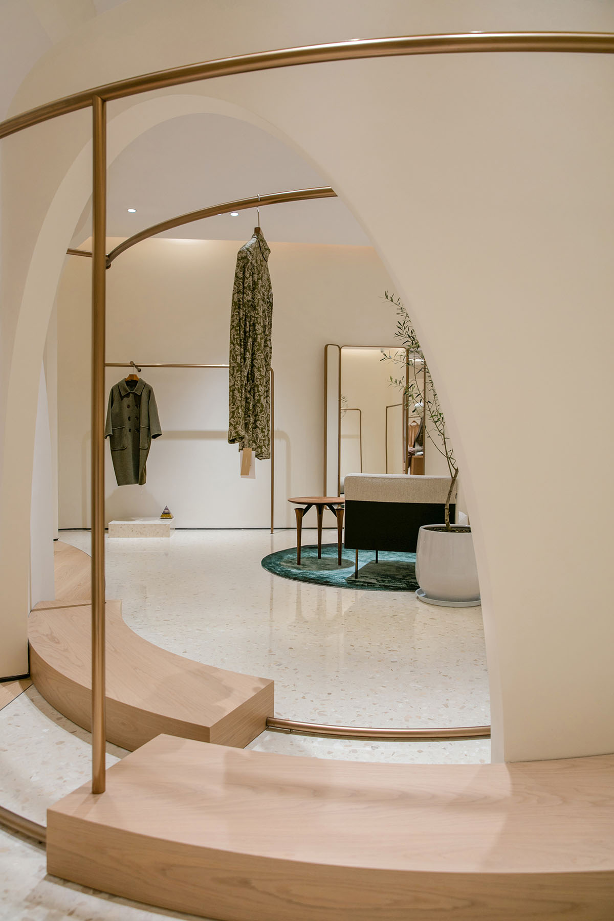 JYDP designs retail space with warm tones and curved walls in Shanghai