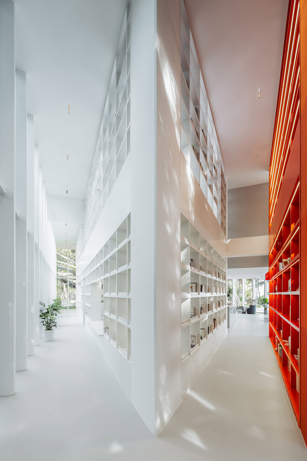 Wutopia Lab elaborates bookstore with red triangular bookshelves for Tianya Books in China 