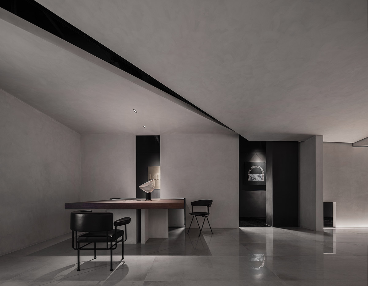 Masanori Designs' interiors include red cylinder bringing rainwater into the space