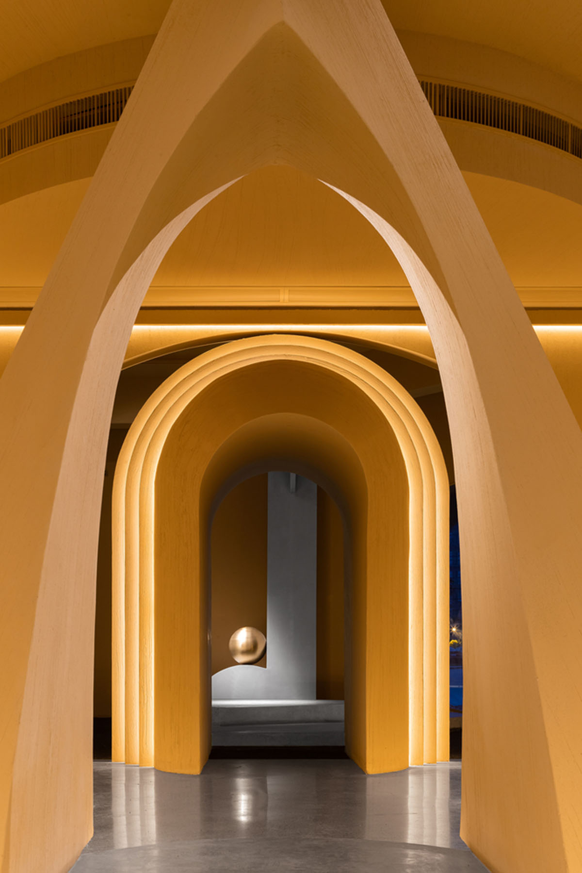 Angular corrugated stainless steel sheets form this showroom designed by PIG DESIGN in Hangzhou