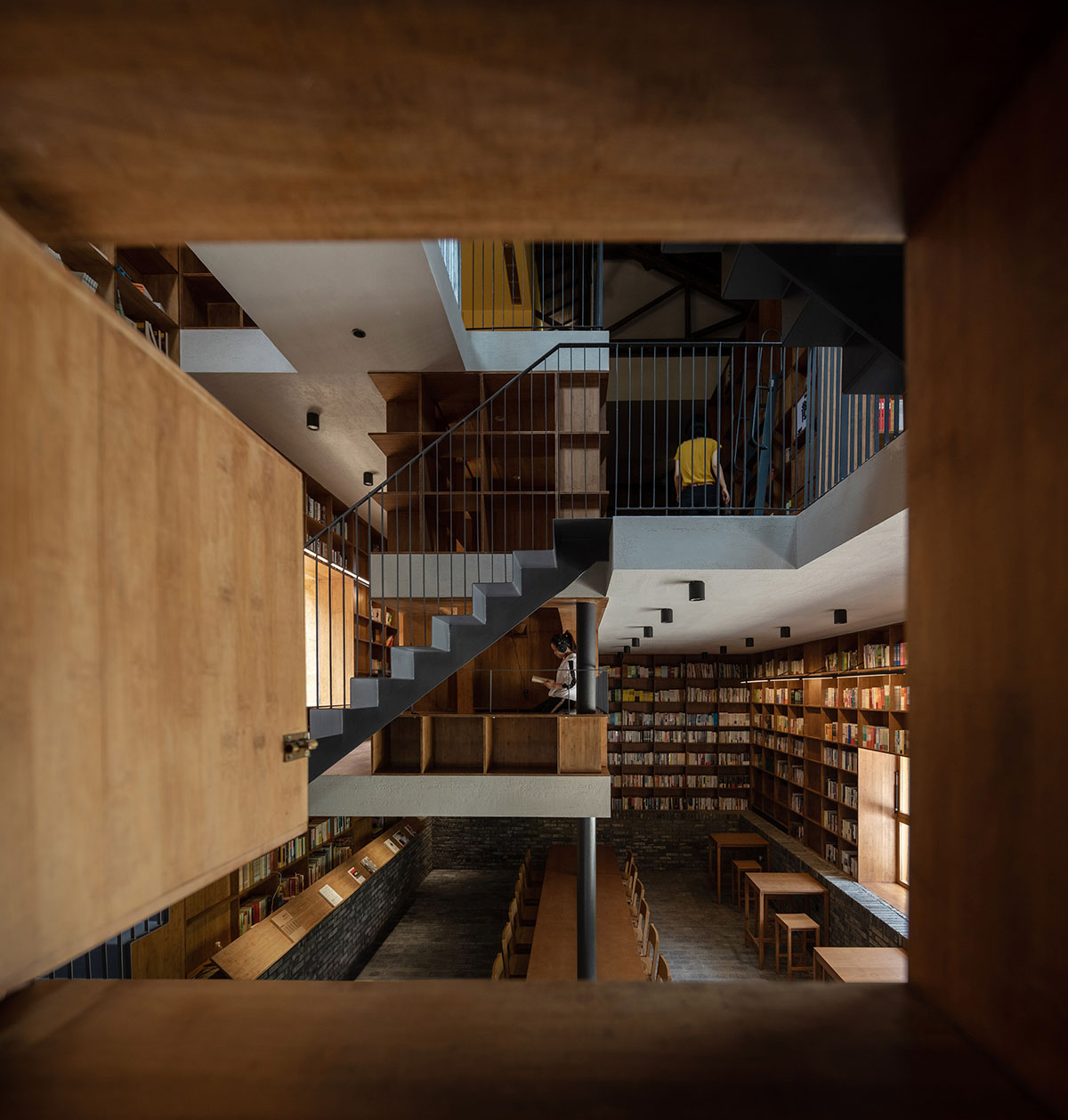 Atelier tao+c converts old building into capsule hotel with corrugated ...