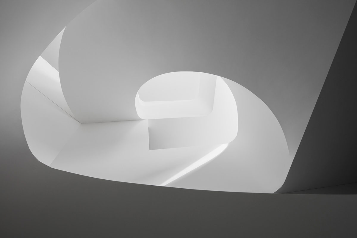 Grey concrete villa by DF_DC is characterised with trapezoidal colonnaded terrace on Comano hills