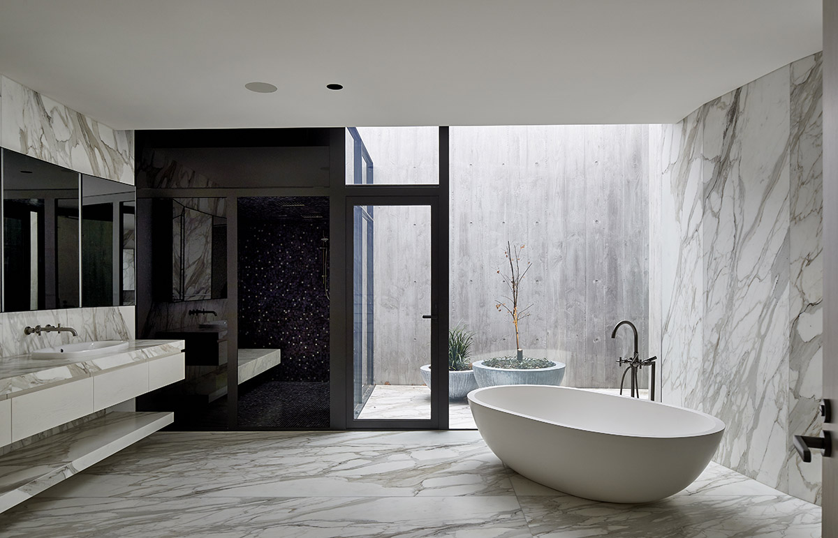 Wood Marsh built sculptural Towers Road House that features disc-shaped zinc roof in Toorak