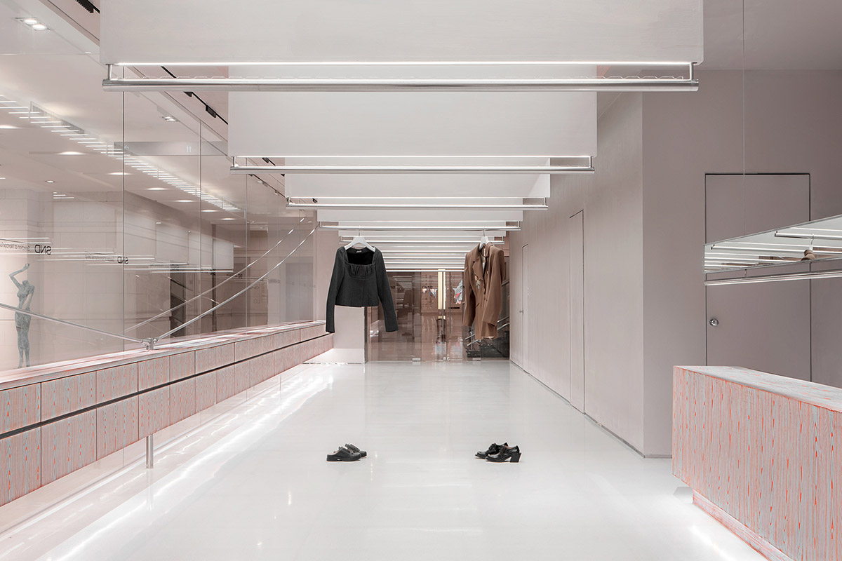 Various Associates creates show-like and pink-hued fashion store under a viaduct in Chongqing