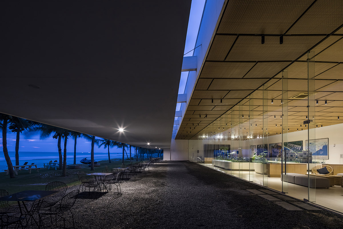 Six landscape boxes form this gallery and showroom by MIA Design Studio in Vietnam