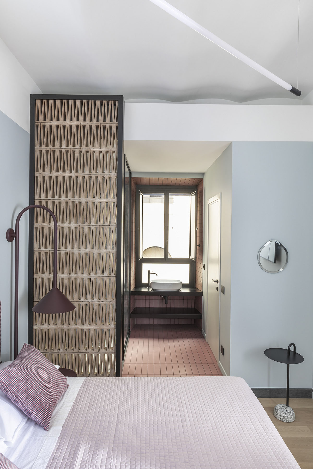 Totem House by STUDIOTAMAT is a rental home presenting cold shades and industrial looking in Rome 