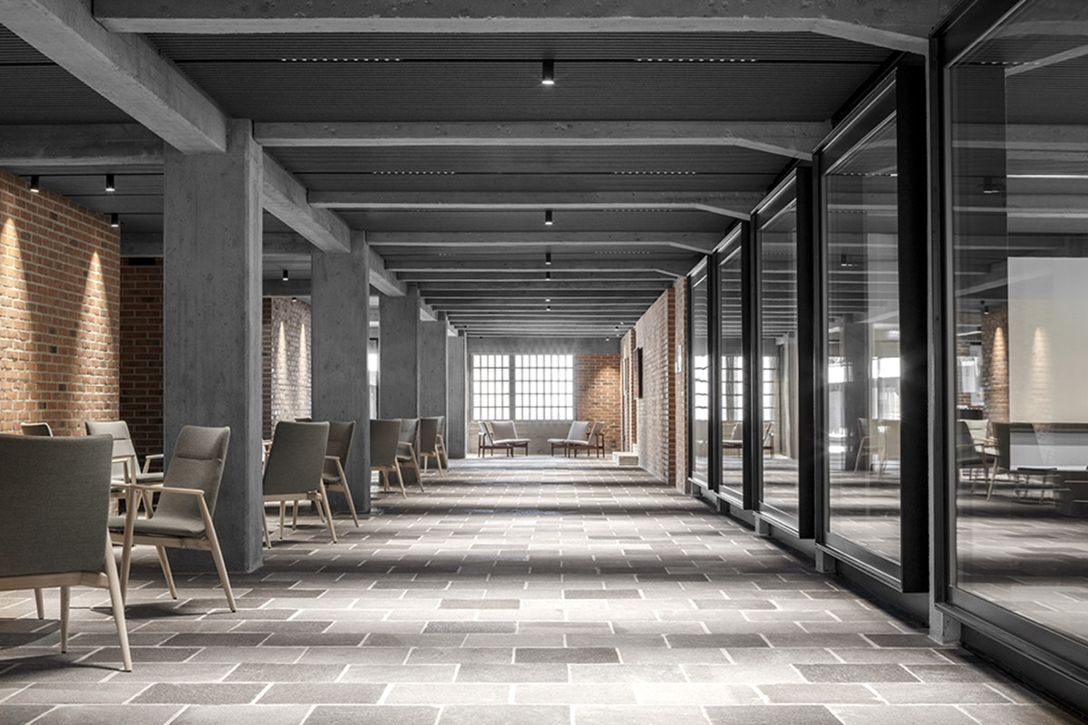 MoDusArchitects renovates Cusanus Academy with subtle elements in Bolzano, Italy