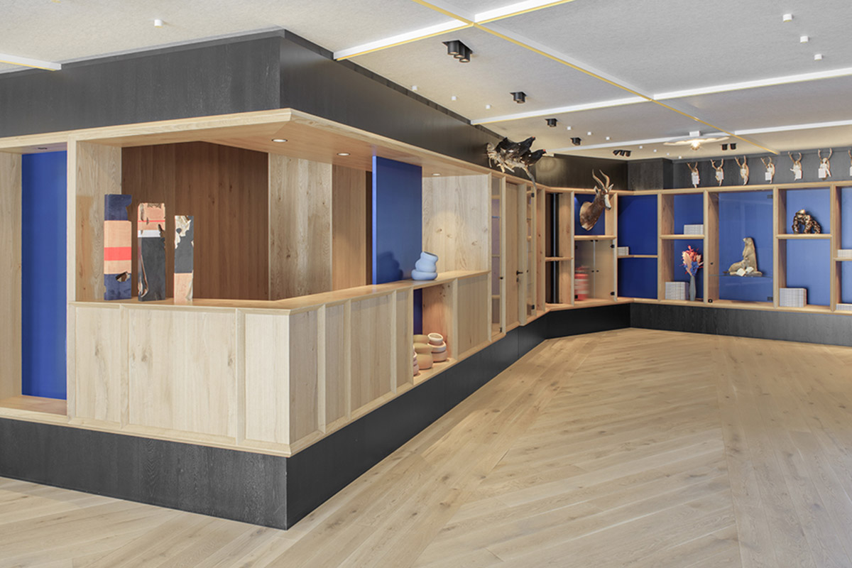 Icaro Hotel featuring wooden colonnade frames embraces alpine heritage landscape in Italy 