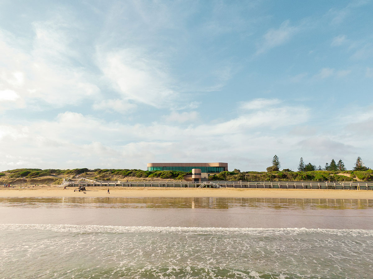 Wood Marsh completes surf club with timber rounded corners echoing ocean and eroded dunes