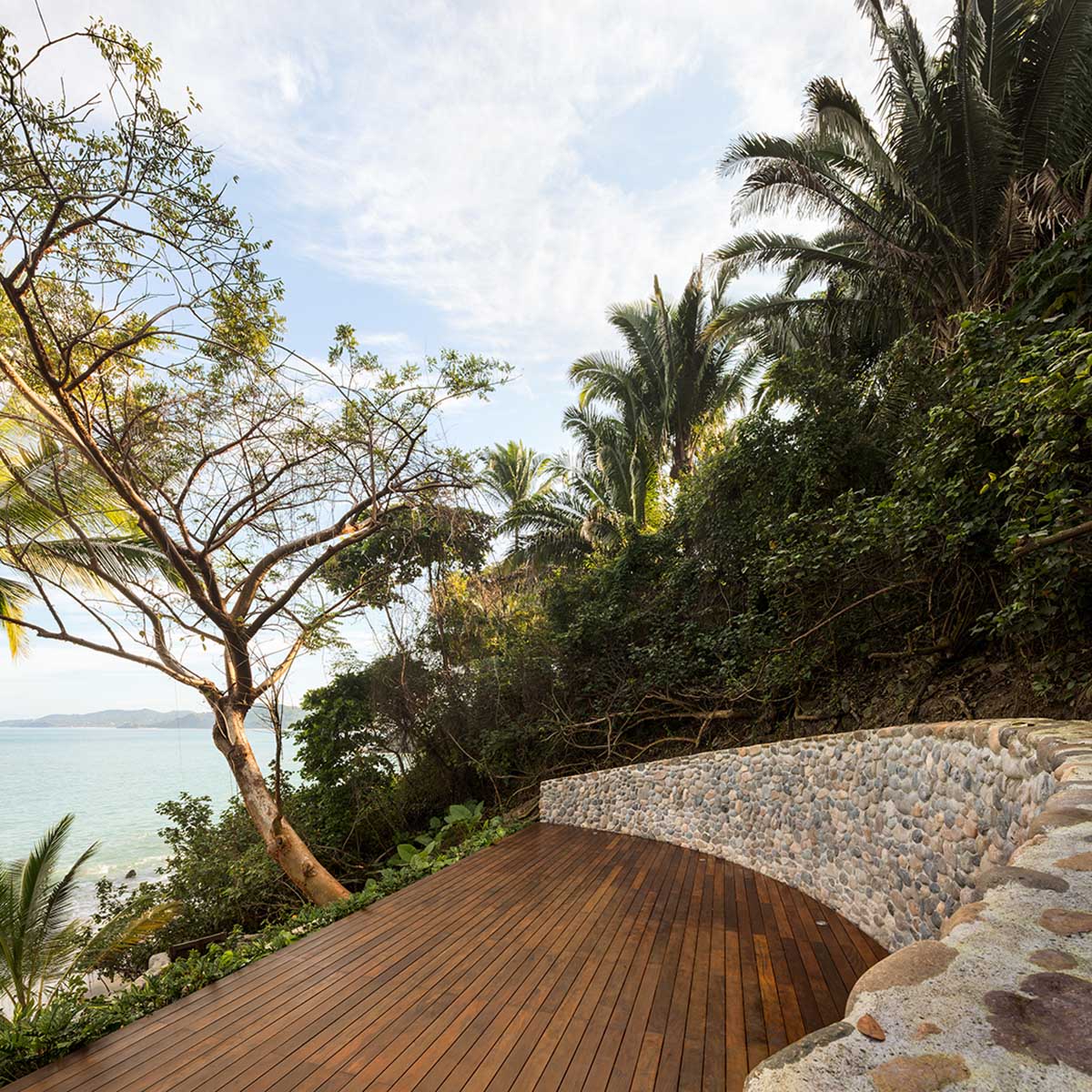 MAIN OFFICE adds half-circle yoga platform to thatched-roof guest villas in Sayulita, Mexico