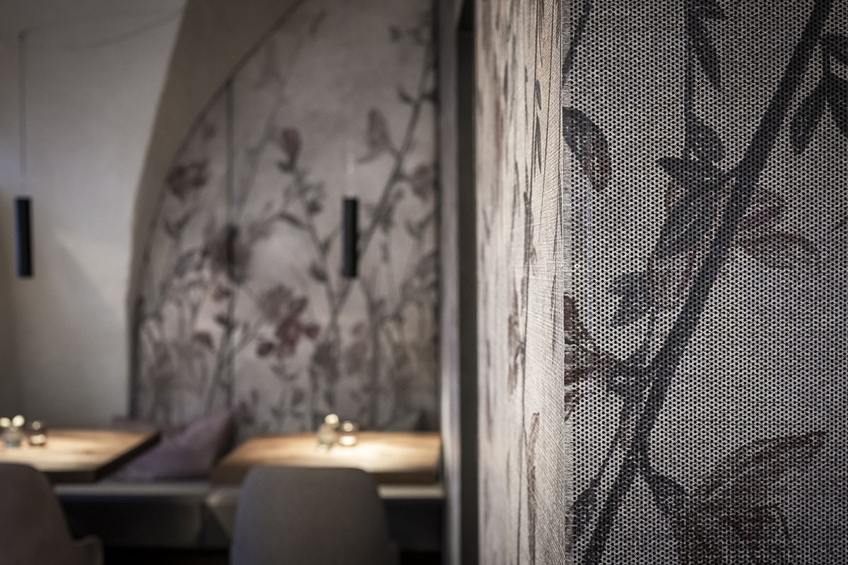 noa* transforms 19th-century workshop house into bohemian-style bistro with deep alcoves in Italy