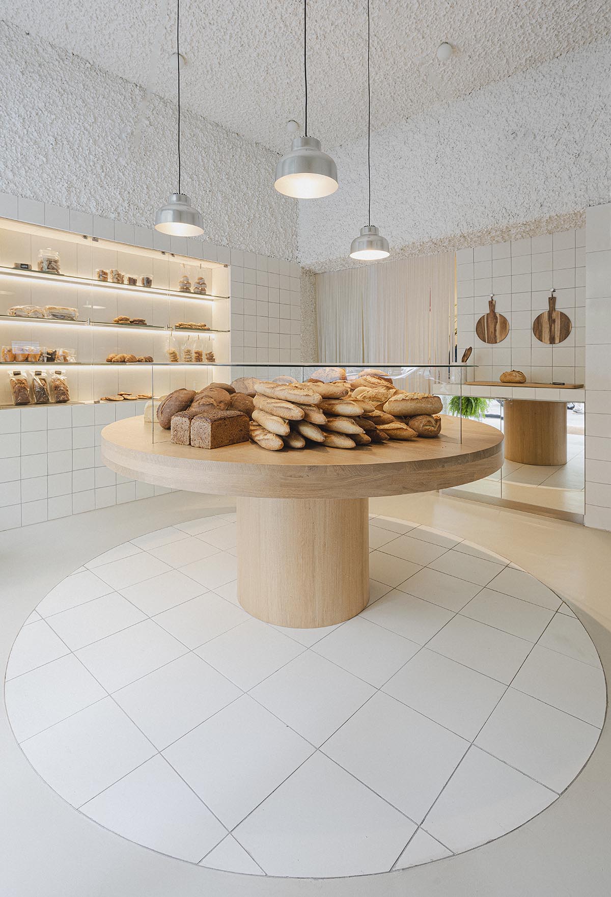 Bakery features central oak tables that revive the traditional dining room experience 