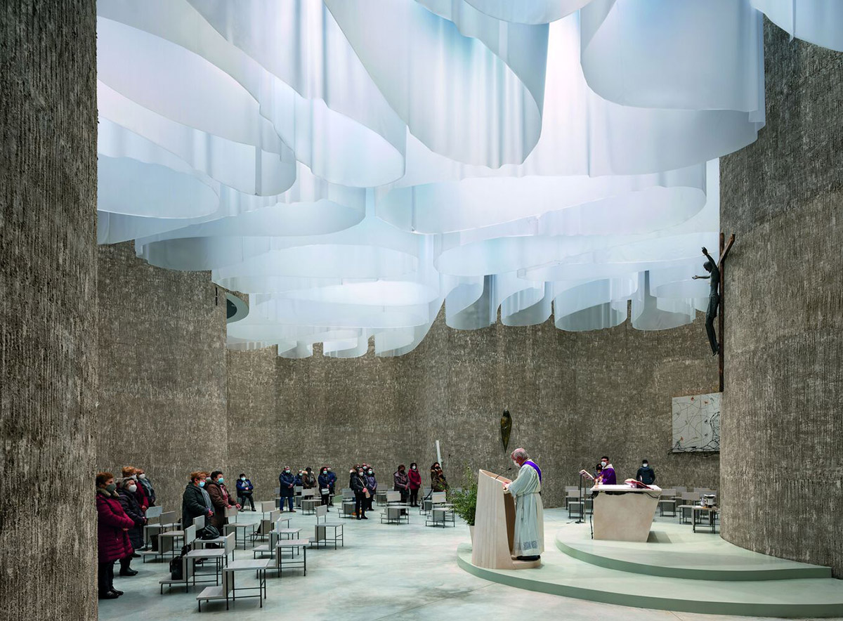 Smooth all-white walls form church designed by Mario Cucinella Architects in Mormanno hill town 