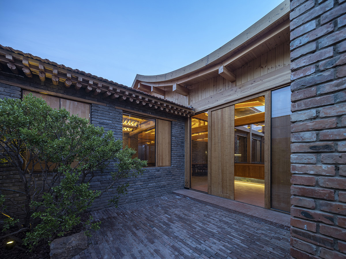 Archstudio renovates Beijing's old courtyard house with new wooden additions 