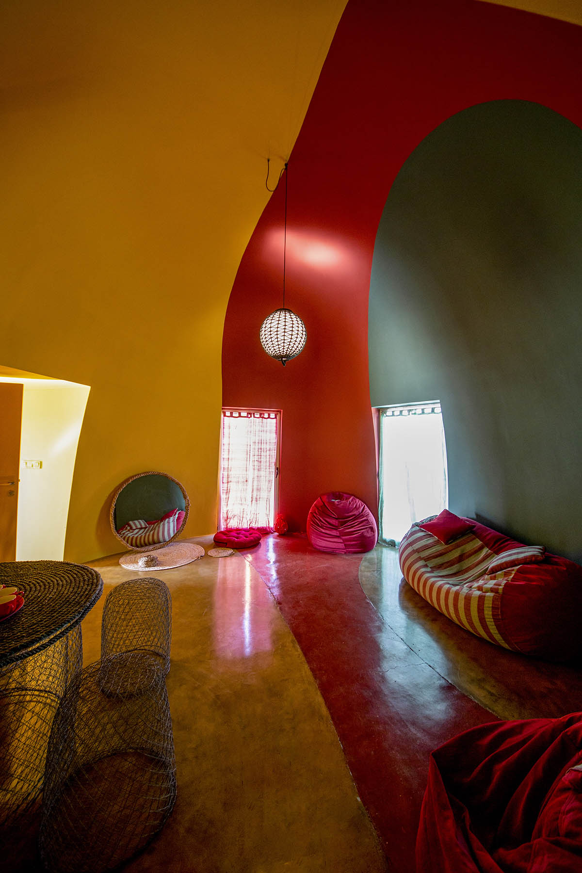 ZAV Architects built colorful-domed housing made of rammed earth and sand on Hormuz island, Iran