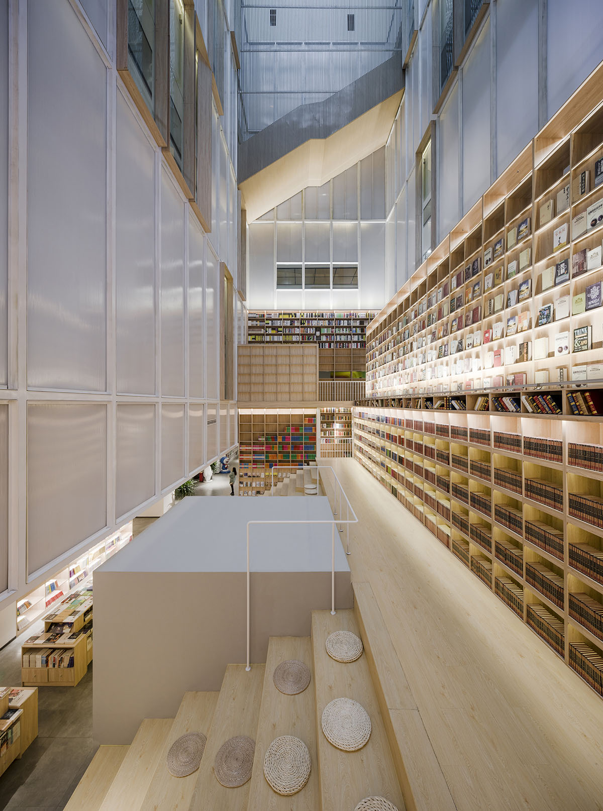y.ad studio designs Yuanping Meijing Bookstore hidden in daylighting atriums in China
