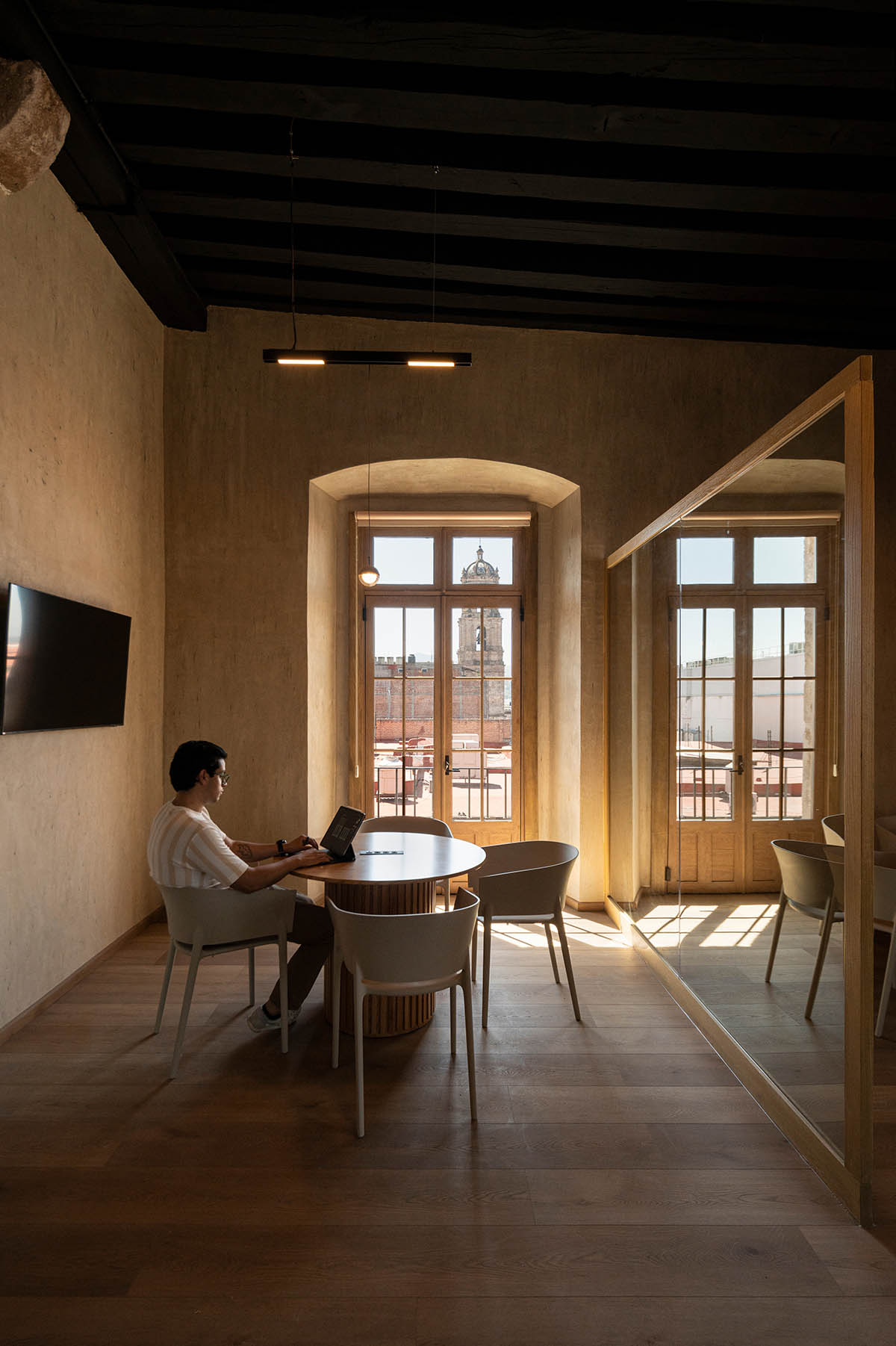 FMA. designs corporate building with warm, earthy tones in a former 17th-century convent