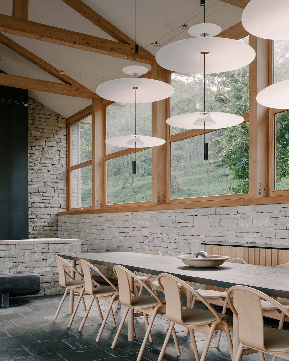 The stone and wood Tbilisi residence integrates architecture with the natural landscape