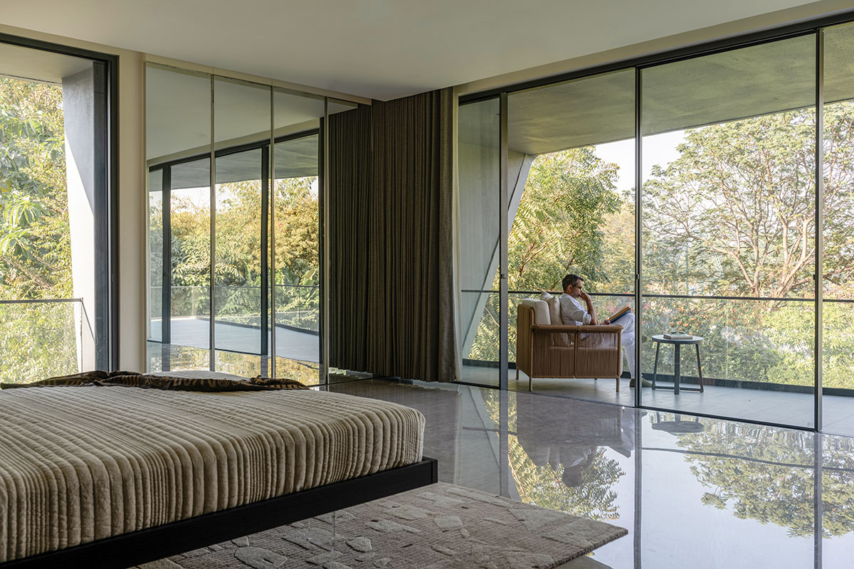 Sanjay Puri Architects uses fluid surfaces to create Nine X Nine House in India