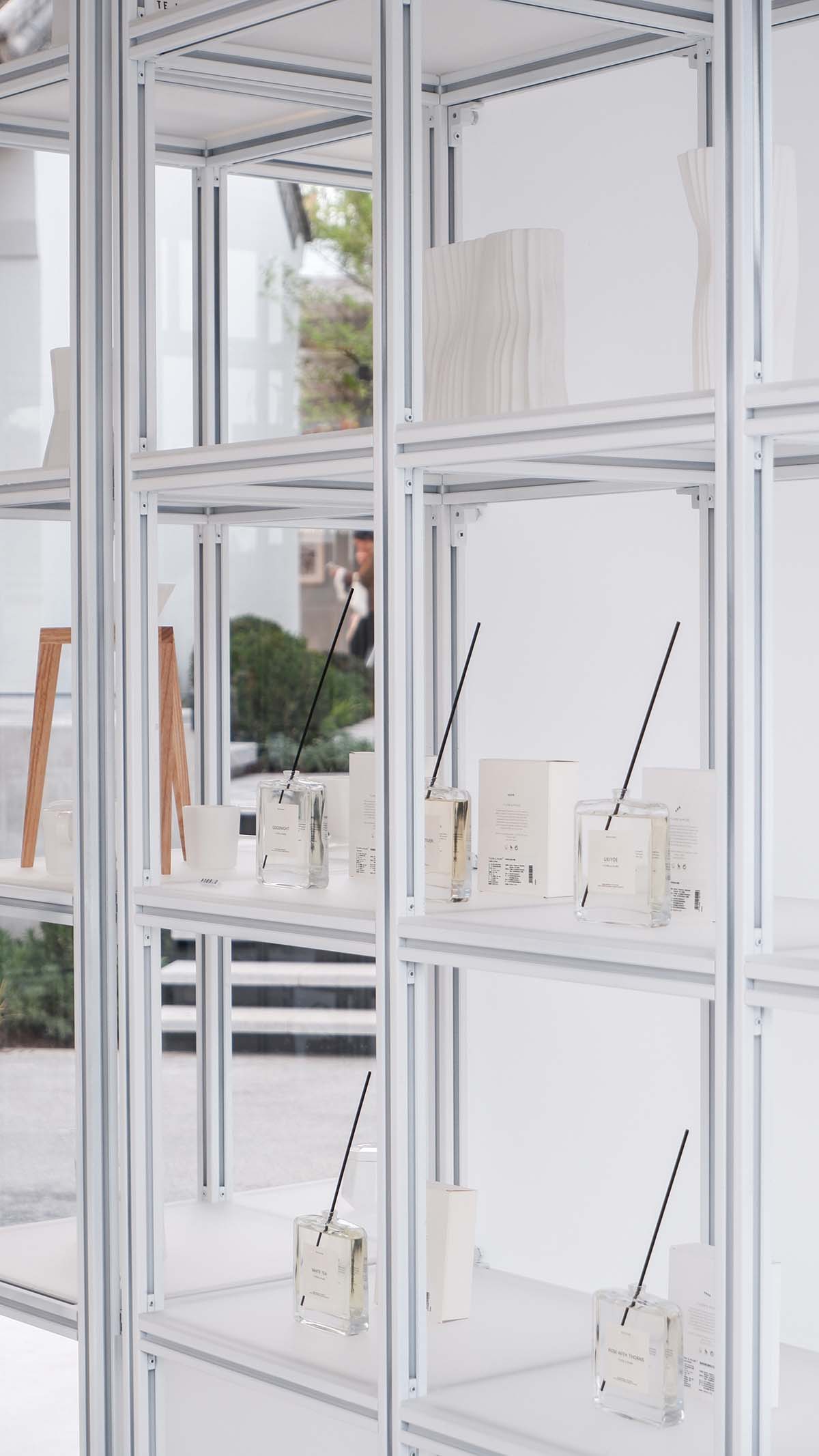 A shop is attached to Beijing historic Hutong houses with white-colored skin