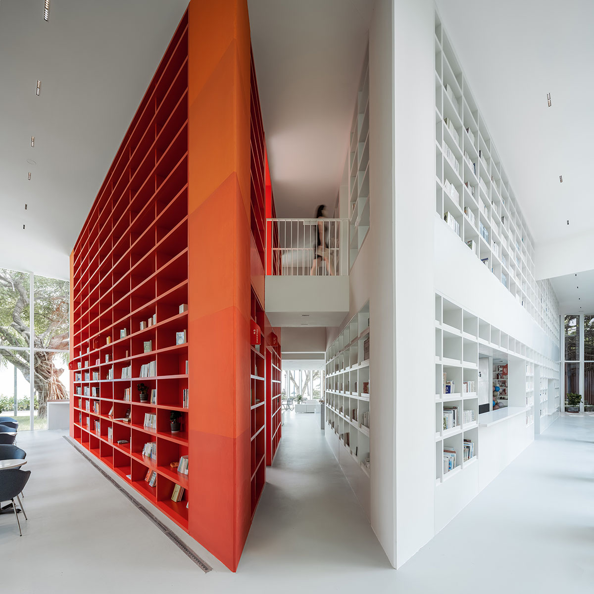 Wutopia Lab elaborates bookstore with red triangular bookshelves for Tianya Books in China 