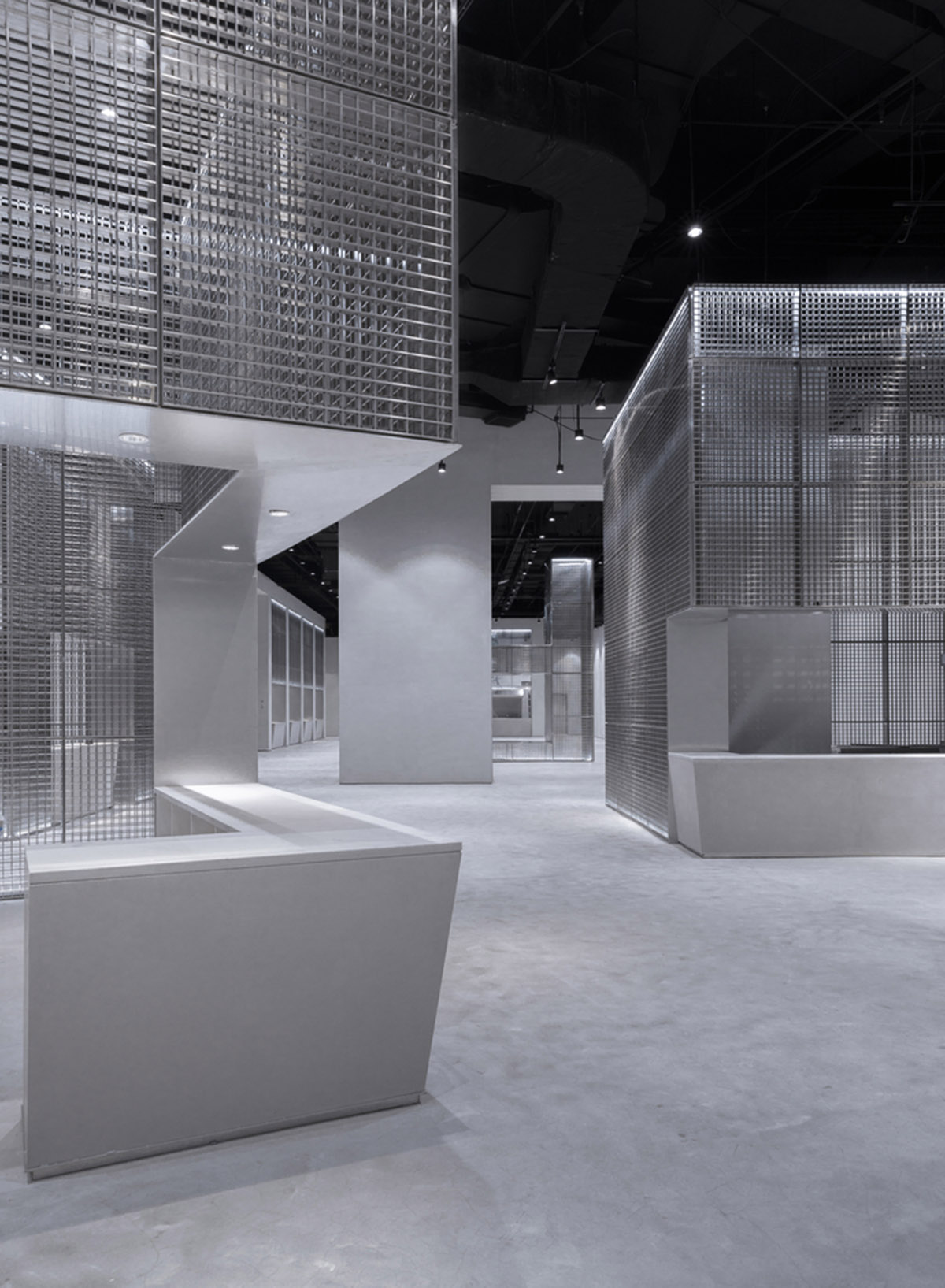 BANDe Architects combines greyscale interior with gridded wooden structures for GreenMonster Lab