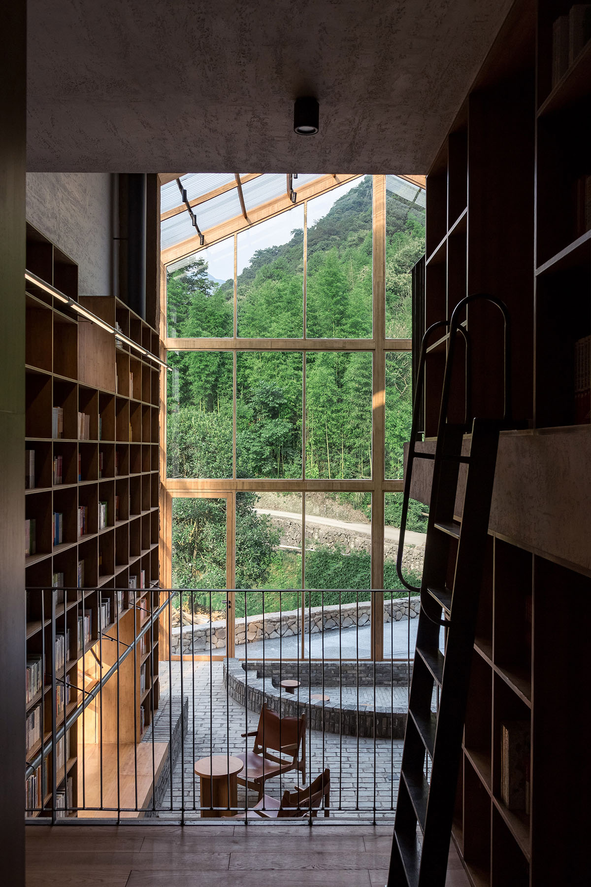 Atelier tao+c converts old building into capsule hotel with corrugated polycarbonate panels in China