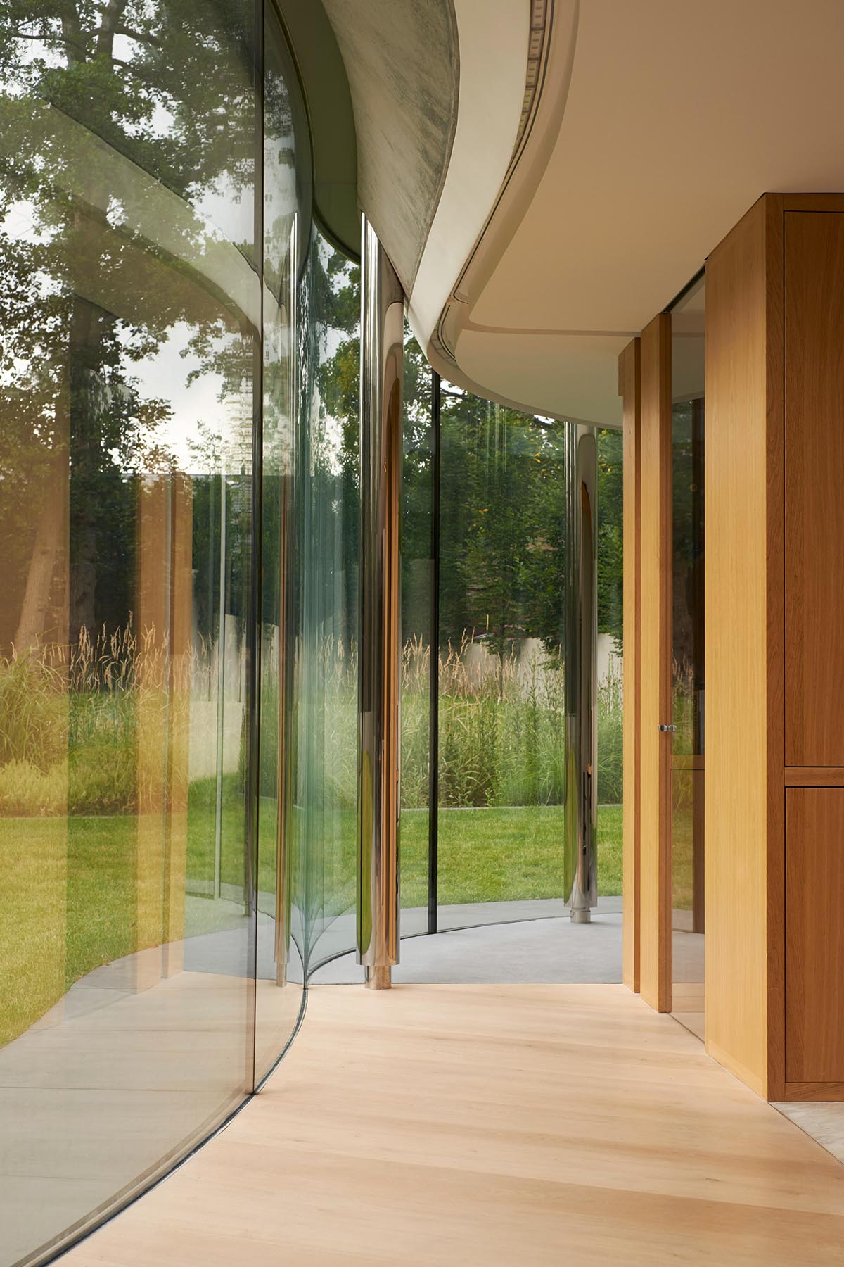 Elegant details and trefoil-shaped garden form this family house by Eldridge London in Coombe Park