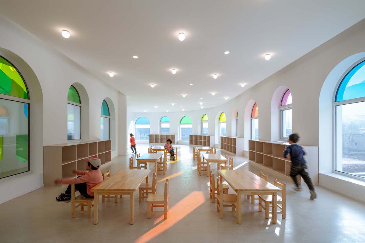 SAKO Architects designs colorful glass doors to evoke children's creativity in this school in China
