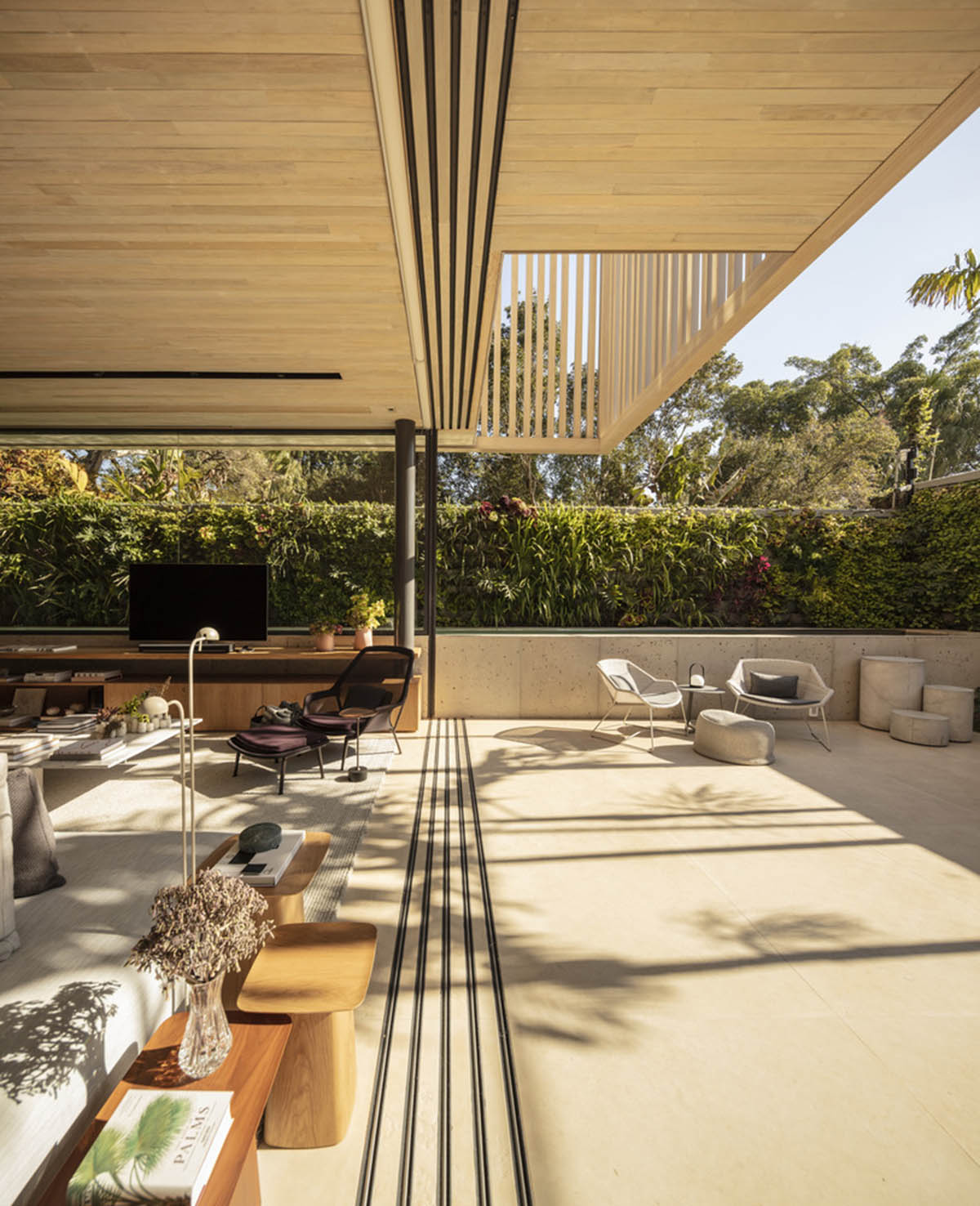 Studio AG designed large wooden residence featuring punctured volumes with gabled roof in São Paulo