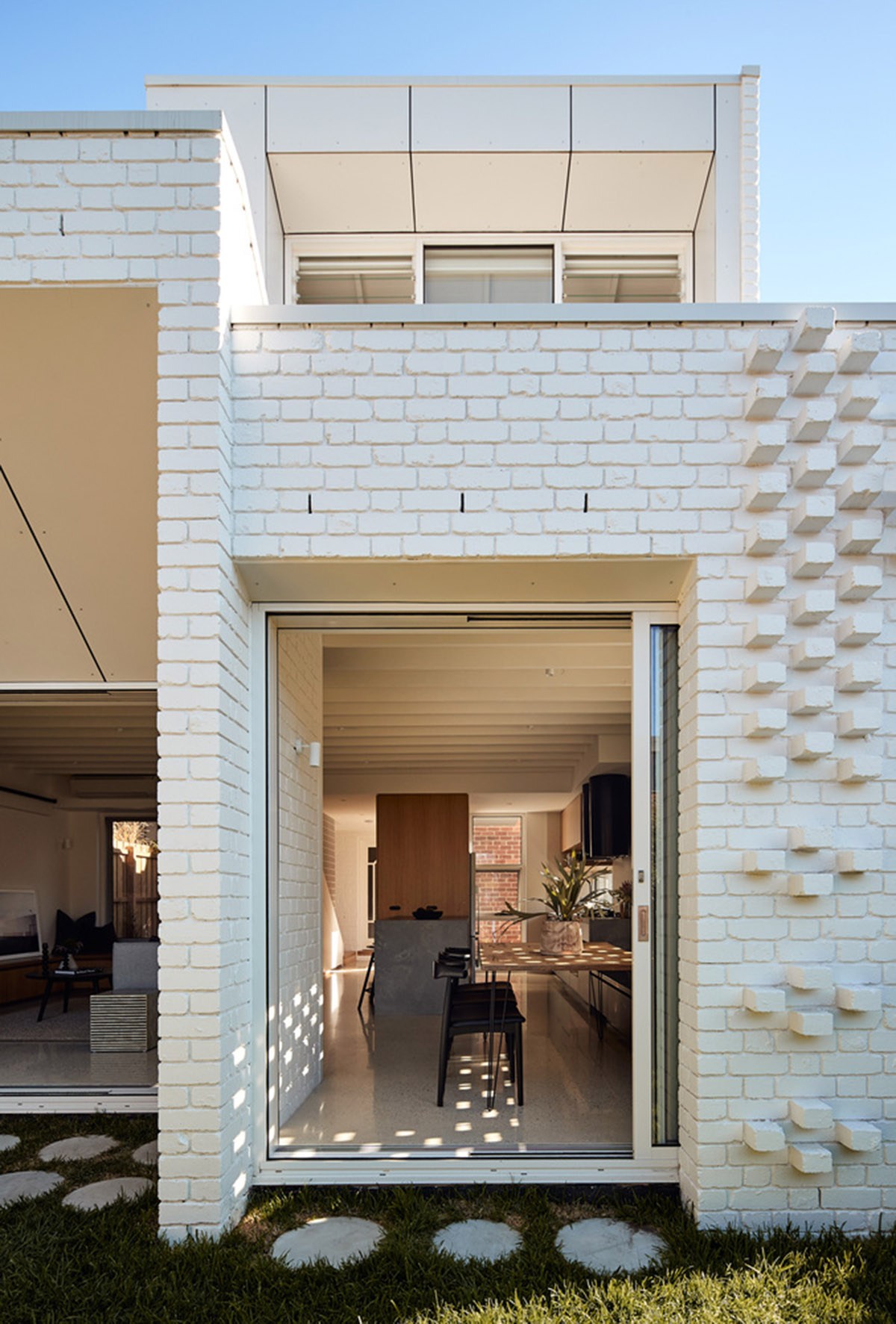 Atelier Red+Black built white Cascade House that features different patterns of brick in Melbourne