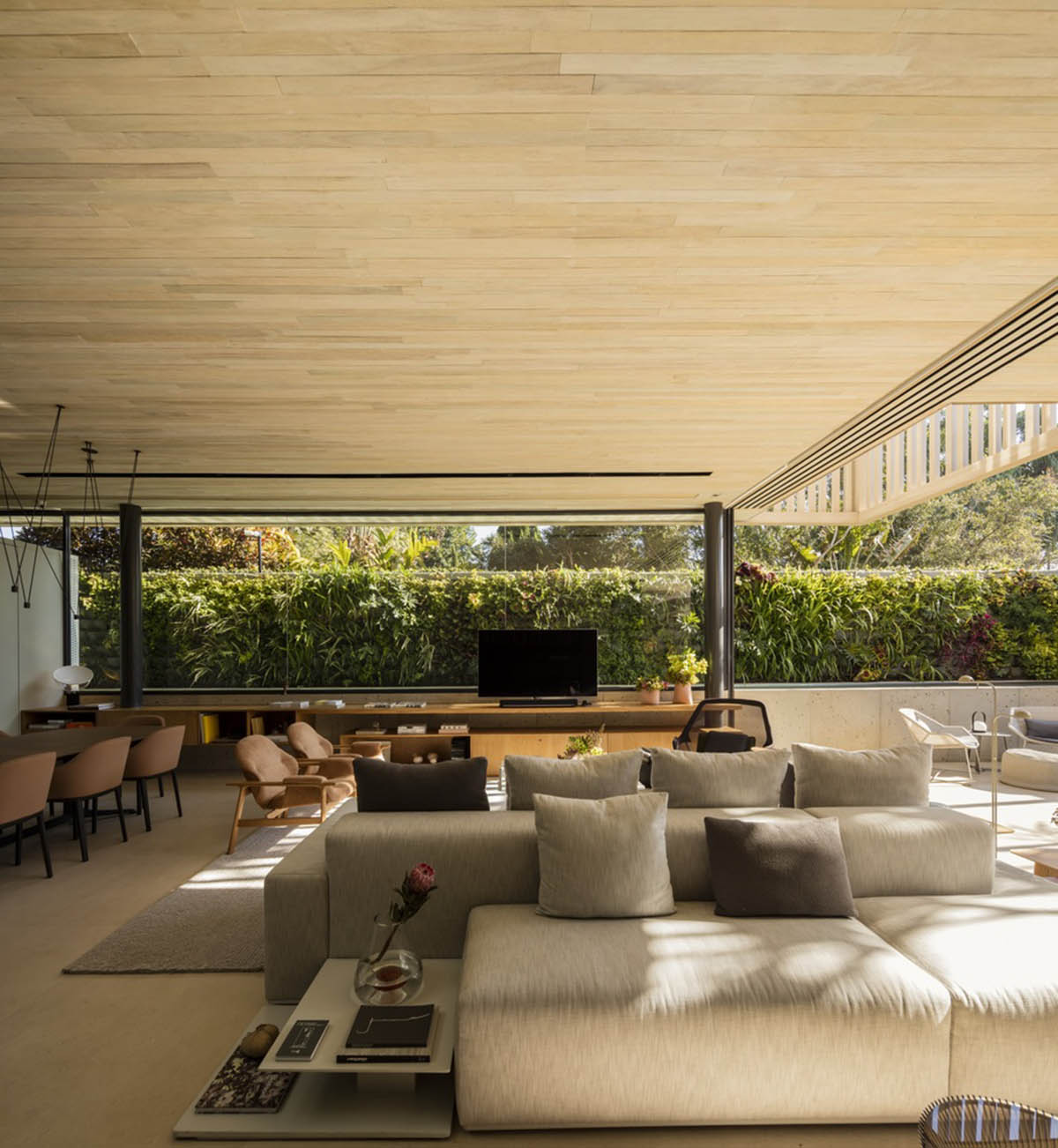 Studio AG designed large wooden residence featuring punctured volumes with gabled roof in São Paulo
