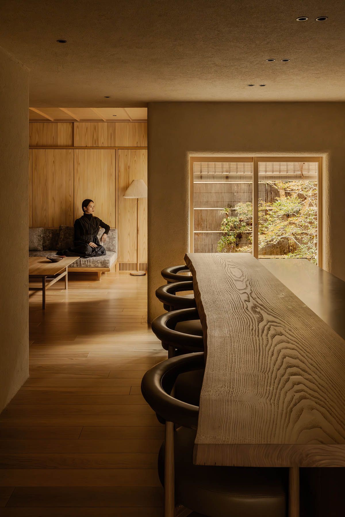 kooo architects creates a wooden interior sanctuary for contemporary accommodation in Kyoto City