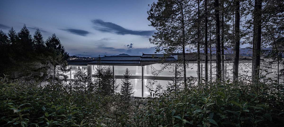 STUDIO QI reinterprets sequence of living conditions with tilted hotel on a hilly plot in China