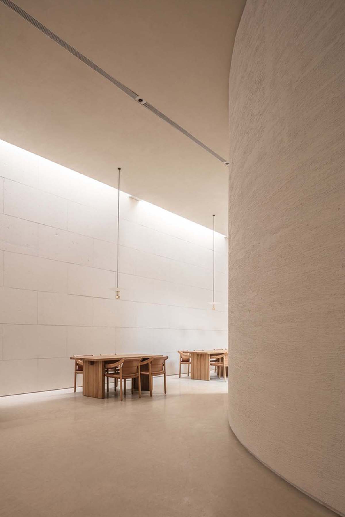 Waterfrom Design creates peaceful interior with wooden furnitures for tea community center in China
