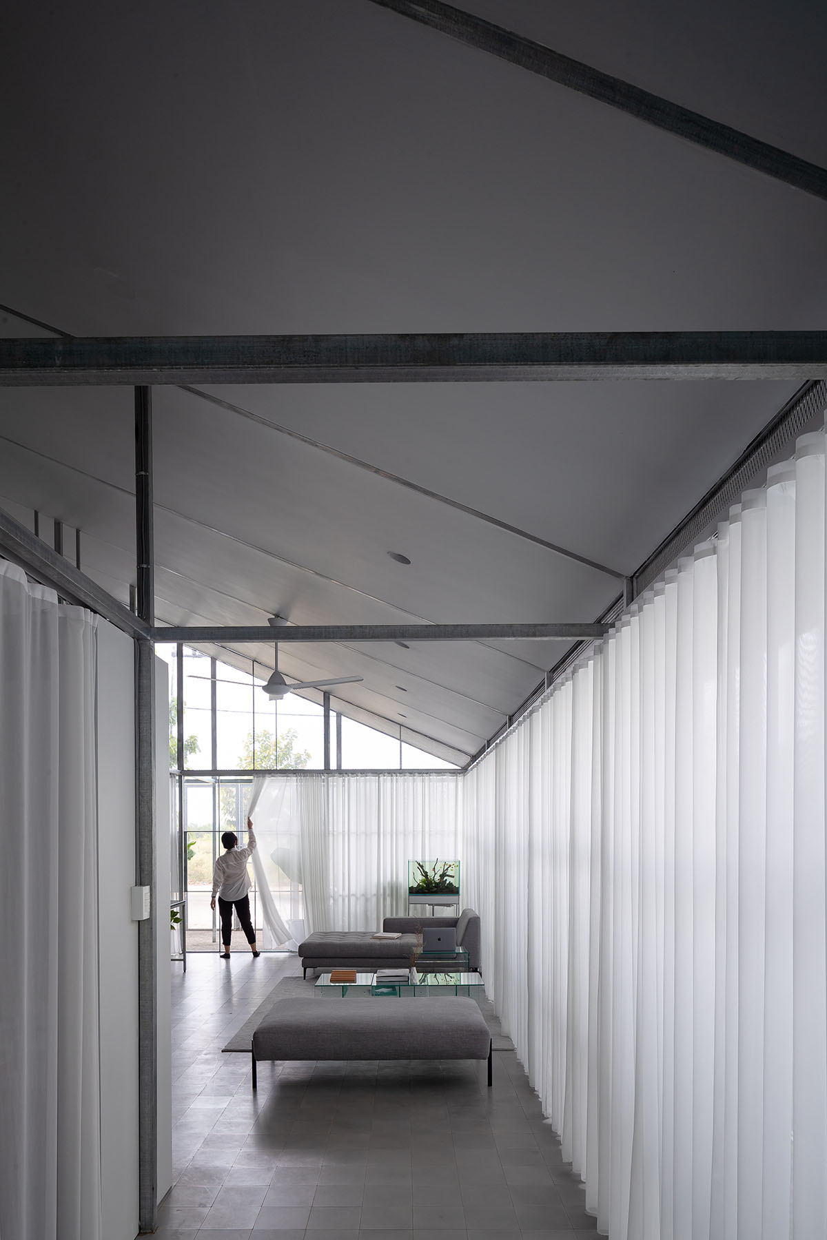 MIA Design Studio completes family house with angular roof in Vietnam 